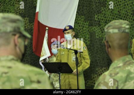 Outgoing commander Lt. Col. Francesco Colucei, with the Italian Army's Task Force Griffon, addresses the audience during a Transfer of Authority ceremony at Erbil Air Base, Iraq. Task Force Griffon, from the 5th Regiment of the Italian Army, is a detachment of three NH-90 medium lift helicopters, aircrew and support personnel based at Erbil Air Base, Iraq, under tactical control (TACON) of Task Force Phoenix. Outgoing commander Lt. Col. Francesco Colucei turned over the unit to Lt. Col. Mario Giorgi. Stock Photo