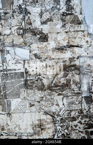 Torn Poster Paper Wall Texture Pattern as Urban Background Vintage. Stock Photo
