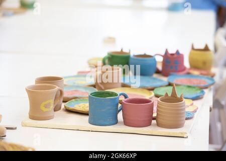 Clay products in the workshop on the table. Clay modeling master class. Stock Photo