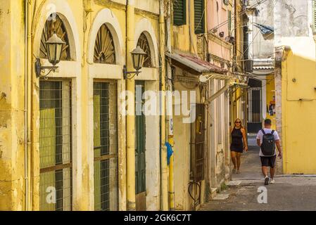 Busy street scenes in Corfu town with shops buildings people and narrow streets Stock Photo