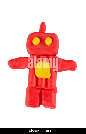 Red robot from plasticine on a white background. Stock Photo