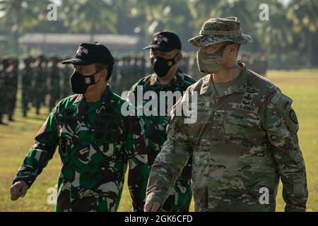 Brigadier Gen. Joseph Ryan, commanding general of the 25th Infantry Division, inspects the formation with a Tentara Nasional Indonesia (TNI-AD Indonesia Armed Forces) general during the closing ceremony for Garuda Shield 21 at Baturaja Training Area, on August 14, 2021. Garuda Shield 21 is a two-week joint-exercise between the United States Army and (TNI-AD Indonesia Armed Forces). The purpose of this joint-exercise is to enhance and enrich the jungle warfare ability of both the U.S. Army and Indonesian Army. Stock Photo