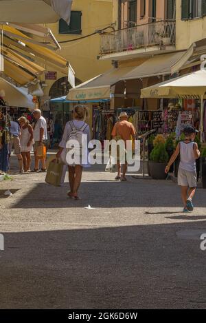 Busy street scenes in Corfu town with shops buildings people and narrow streets Stock Photo