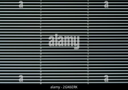 Blinds background. Window with metal shutters in the interior of the living room. High quality photo Stock Photo