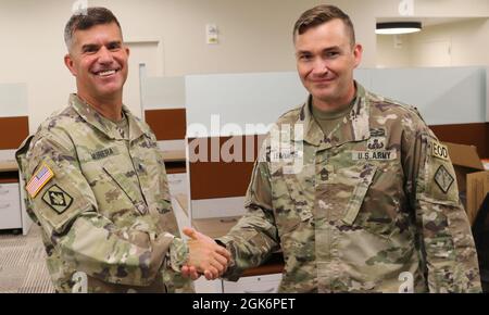 Then Brig. Gen. Antonio V. Munera (left), the commanding general for ...