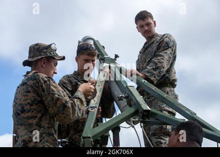 U.S. Marines with 2d Combat Engineer Battalion, 2d Marine Division, prepare a mine clearing line charge (MCLC) on Camp Lejeune, N.C., Aug. 19, 2021. The MCLC is an explosive system that is fired to clear an 8-by-100 meter path for troops in combat. Stock Photo