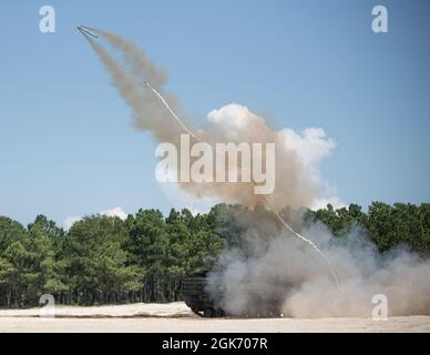 U.S. Marines with 2d Combat Engineer Battalion, 2d Marine Division, fire a mine clearing line charge (MCLC) on Camp Lejeune, N.C., Aug. 19, 2021. The MCLC is an explosive system that is fired to clear an 8-by-100 meter path for troops in combat. Stock Photo