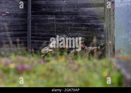 Danish Soldiers within Danish army's 2nd Armored Infantry Battalion, conduct live-fire exercise Wild Leopard Aug. 19 2021, at Grafenwoehr Training Area, Germany. The purpose of the exercise is to train platoon and company sized infantry forces together in wooded and urban terrain. Stock Photo