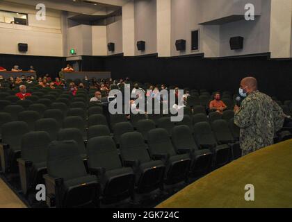 Capt. David Adams Commander, Fleet Activities Sasebo (CFAS) speaks to Department of Defense Education Activity (DODEA) teachers and staff during a meeting at CFAS’s Showboat Theater Aug. 20, 2021. The meeting was held to discuss the reopening of  schools in Sasebo for the 2021-2022 school year. Stock Photo