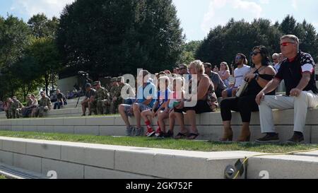 Family members and friends attend the call to duty ceremony for the 204th Engineer Detachment (Construction Management Team) Aug. 20, 2021, at Genoa Park in downtown Columbus, Ohio. During the yearlong deployment, the Soldiers will provide construction management support to U.S. Central Command. Stock Photo