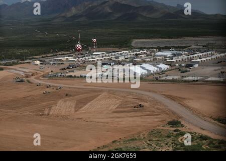 Area photo of the progression of Dona Ana Housing Area near Fort Bliss, Texas, Aug. 22, 2021. The Department of Defense, in support of the Department of State, is providing transportation and temporary housing in support of Operation Allies Refuge. This initiative follows through on America's commitment to Afghan citizens who have helped the United States, and provides them essential support at secure locations outside Afghanistan. Stock Photo