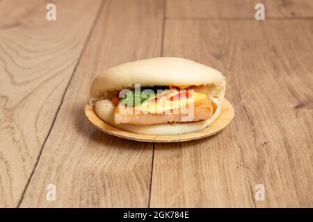 Iberian bath with piece of bacon on wooden table Stock Photo