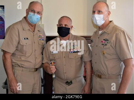 Flanked by Rear Adm. Bruce Gillingham, Navy surgeon general and chief, Bureau of Medicine and Surgery and Force Master Chief Michael Roberts, Director of the Hospital Corps, Chief Hospital Corpsman Danny Williams, assigned to Navy Readiness and Training Command Stock Photo
