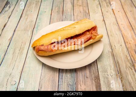 Fried tenderloin sandwich on white plate Stock Photo