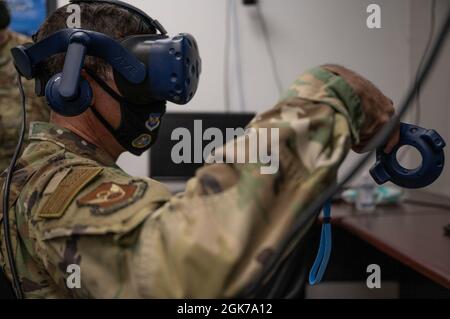 Maj. Gen. Andrew Gebara, 8th Air Force and Joint-Global Strike Operations Center commander, tests a virtual reality training headset at Dyess Air Force Base, Texas, Aug. 23, 2021. Gebara participated in an engine test cell virtual reality fire training scenario. Stock Photo