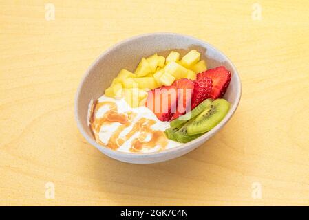 Chopped fresh fruits arranged on cutting board on white wooden surface, top  view. Ingredients for fruit salad. From above, flat lay, overhead Stock  Photo - Alamy