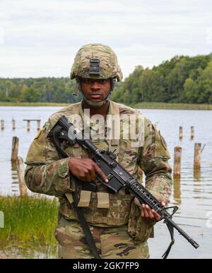 Pfc. Gregory Roberts, an infantryman with Alpha Company “Orphans,” 2nd Battalion, 34th Armored Regiment, 1st Armored Brigade Combat Team, 1st Infantry Division, stops for a photo during 2-34's sniper selection at Drawsko Pomorskie Training Area, Poland, Aug. 25, 2021. “Being selected feels great; it has been one of my dreams,” Roberts said. “Since before I joined the Army, I wanted to be a sniper.” Stock Photo