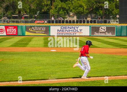 baseball player running the bases after a hit Stock Photo