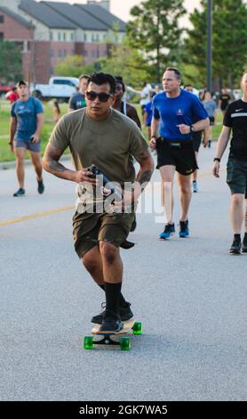 U.S. Army Paratroopers assigned to the 82nd Airborne Division and their families participate in the All American Family Fun Run at Fort Bragg, N.C., on August 30, 2021. Stock Photo