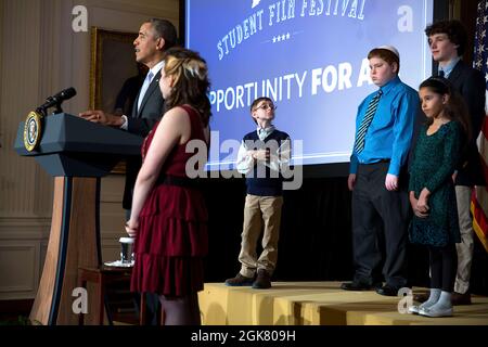 President Barack Obama delivers remarks during the White House Student Film Festival in the East Room of the White House, Feb. 28, 2014. The event highlights the Administration's commitment to expanding high-speed Internet connectivity and educational technology in classrooms.  (Official White House Photo by Pete Souza) This official White House photograph is being made available only for publication by news organizations and/or for personal use printing by the subject(s) of the photograph. The photograph may not be manipulated in any way and may not be used in commercial or political material Stock Photo