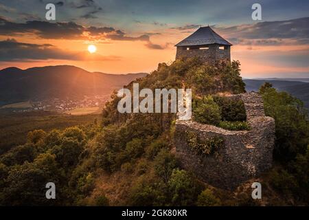 Salgotarjan, Hungary - Aerial view of the ruins of Salgo Castle (Salgo vara) in Nograd county with a beautiful dramatic sunset at summer time Stock Photo