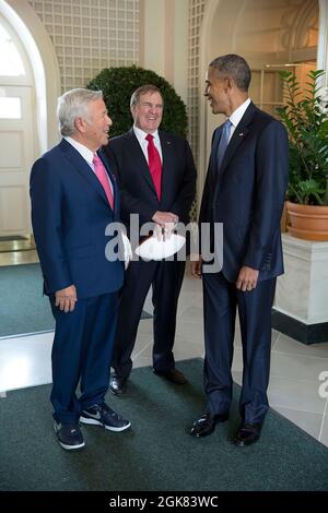 President Barack Obama talks with New England Patriots owner Robert Kraft, left, and Coach Bill Belichick in the West Garden Room of the White House prior to an event to honor the team and their Super Bowl XLIX victory, on the South Lawn of the White House, April 23, 2015. (Official White House Photo by Pete Souza) This official White House photograph is being made available only for publication by news organizations and/or for personal use printing by the subject(s) of the photograph. The photograph may not be manipulated in any way and may not be used in commercial or political materials, ad Stock Photo