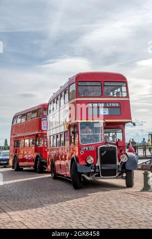 Vintage buses carying passengers around King's Lynn as part of the town's Heritage Open Day. Stock Photo