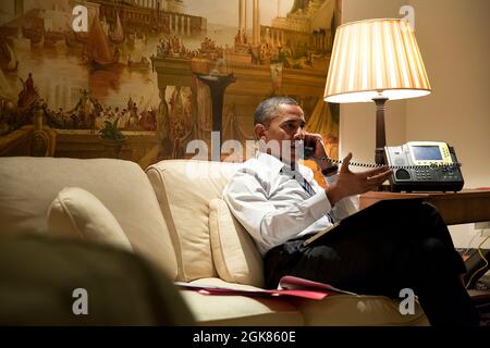 President Barack Obama talks on the phone with European leaders to consult about the situation in eastern Ukraine. The President spoke with President François Hollande of France, Chancellor Angela Merkel of Germany, Prime Minister Matteo Renzi of Italy, and Prime Minister David Cameron of the United Kingdom from his hotel suite in Seoul, Republic of Korea, April 25, 2014. (Official White House Photo by Pete Souza) President Barack Obama talks on the phone with European leaders to consult about the situation in eastern Ukraine. The President spoke with President François Hollande of France, Cha Stock Photo
