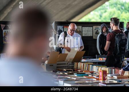 Nestled under Waterloo Bridge is one of the only permanent outdoor second hand book markets in the south of England. UK, London, August 15, 2021 Stock Photo