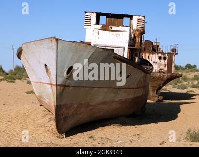 Boats in desert around Moynaq, Muynak or Moynoq - Aral sea or Aral lake - Uzbekistan - asia Stock Photo