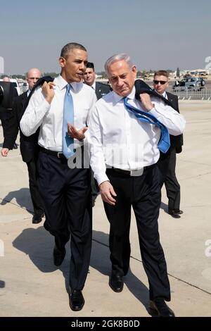 President Barack Obama walks across the tarmac with Israeli Prime Minister Benjamin Netanyahu at Ben Gurion International Airport in Tel Aviv, Israel, March 20, 2013. (Official White House Photo by Pete Souza) This official White House photograph is being made available only for publication by news organizations and/or for personal use printing by the subject(s) of the photograph. The photograph may not be manipulated in any way and may not be used in commercial or political materials, advertisements, emails, products, promotions that in any way suggests approval or endorsement of the Presiden Stock Photo
