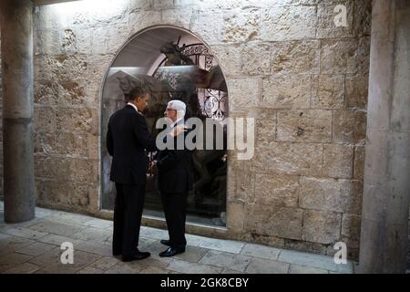 President Barack Obama and President Mahmoud Abbas of the Palestinian Authority talk following their tour of the Church of the Nativity in Bethlehem, the West Bank, March 22, 2013. (Official White House Photo by Pete Souza) This official White House photograph is being made available only for publication by news organizations and/or for personal use printing by the subject(s) of the photograph. The photograph may not be manipulated in any way and may not be used in commercial or political materials, advertisements, emails, products, promotions that in any way suggests approval or endorsement o Stock Photo