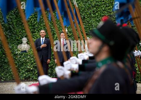 President Barack Obama and Italian Prime Minister Matteo Renzi stand in front of the honor guard as the U.S. national anthem is played during an arrival ceremony at Villa Madama in Rome, Italy, March 27, 2014. (Official White House Photo by Pete Souza) This official White House photograph is being made available only for publication by news organizations and/or for personal use printing by the subject(s) of the photograph. The photograph may not be manipulated in any way and may not be used in commercial or political materials, advertisements, emails, products, promotions that in any way sugge Stock Photo