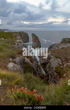 Spectacular scenery of rough rocky formations of various shapes in acantilados del Infierno in Asturias Spain Stock Photo