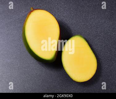 the yellow flesh of a sliced mango Stock Photo
