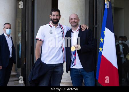 French handball players Nikola Karabatic and Vincent Gerard pose prior to the ceremony in honor of the Olympic and Paralympic French medalists at the Tokyo 2021, in Paris on September 13, 2021. Photo by Raphael Lafargue/ABACAPRESS.COM Stock Photo