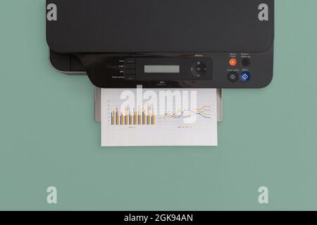 Printer on green background. Top view with copy space. Flat lay. Stock Photo