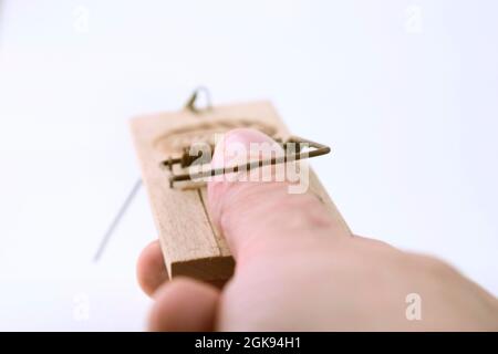 thumb in a mousetrap Stock Photo