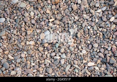 Natural pebbles stone texture background and wallpaper. Pebbles stone decoration in Japanese Zen garden style. Stones as part of the pathway. Beautifu Stock Photo