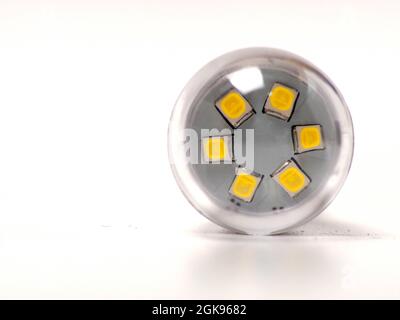 Close up shoot of white small led bulb with e12 socket. Isolated on white background. Stock Photo