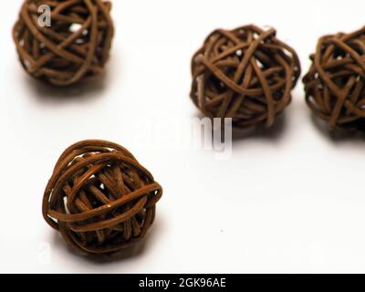close up shoot of brown rattan ball. Shoot on a white isolated background. Stock Photo