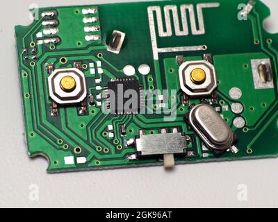 Green Printed Circuit Board (PCB) with some Surface Mount Device (SMD) components and chips. Shoot on white isolated background. Stock Photo