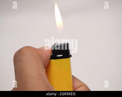 Picture of yellow lighter. Shoot on white isolated background Stock Photo