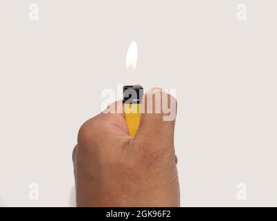 Picture of yellow lighter. Shoot on white isolated background Stock Photo