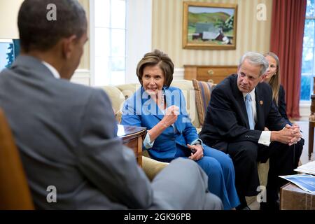 President Barack Obama meets with House Minority Leader Nancy Pelosi, D-Calif. and Democratic Congressional Campaign Committee Chairman Rep. Steve Israel, D-N.Y. in the Oval Office, July 31, 2014. Kelly Ward, Executive Director of the DCCC, seated at right. (Official White House Photo by Pete Souza) This official White House photograph is being made available only for publication by news organizations and/or for personal use printing by the subject(s) of the photograph. The photograph may not be manipulated in any way and may not be used in commercial or political materials, advertisements, em Stock Photo