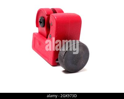 Picture of red mini pipe cutter that usually used by technician to cut small pipe. Shoot on isolated white background. Stock Photo
