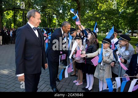 President Barack Obama, with President Toomas Hendrik Ilves of Estonia, greets students during an official arrival ceremony at Kadriorg Palace in Tallinn, Estonia, Sept. 3, 2014. (Official White House Photo by Pete Souza) This official White House photograph is being made available only for publication by news organizations and/or for personal use printing by the subject(s) of the photograph. The photograph may not be manipulated in any way and may not be used in commercial or political materials, advertisements, emails, products, promotions that in any way suggests approval or endorsement of Stock Photo