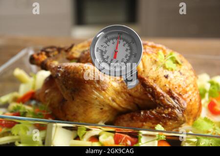 Pop-up thermometer timer in a smoked turkey Stock Photo - Alamy