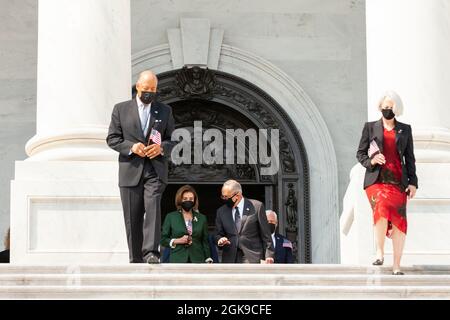 Washington DC, USA. 13th Sep 2021. House Speaker Nancy Pelosi (D-CA) and Senate Majority Leader Chuck Schumer (D-NY) lead members of Congress down the center steps for a ceremony on the Capitol steps in remembrance of the victims of the September 11th attacks. Credit: Allison Bailey/Alamy Live News