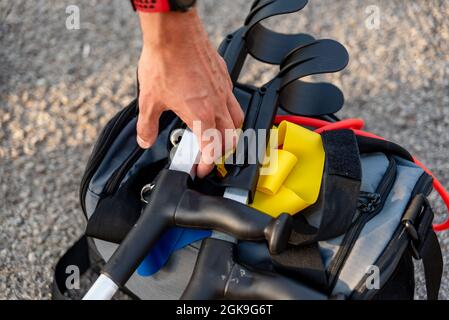 Close up of a human hand catching crutches. Stock Photo